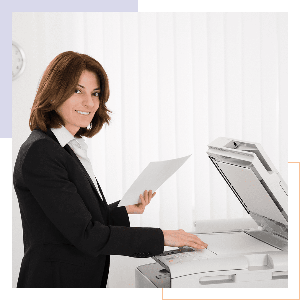Woman using a photocopier in office.